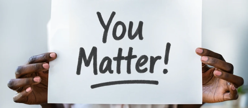 Person holding a sign that says You Matter!